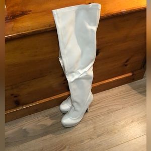 Thigh high heeled boots